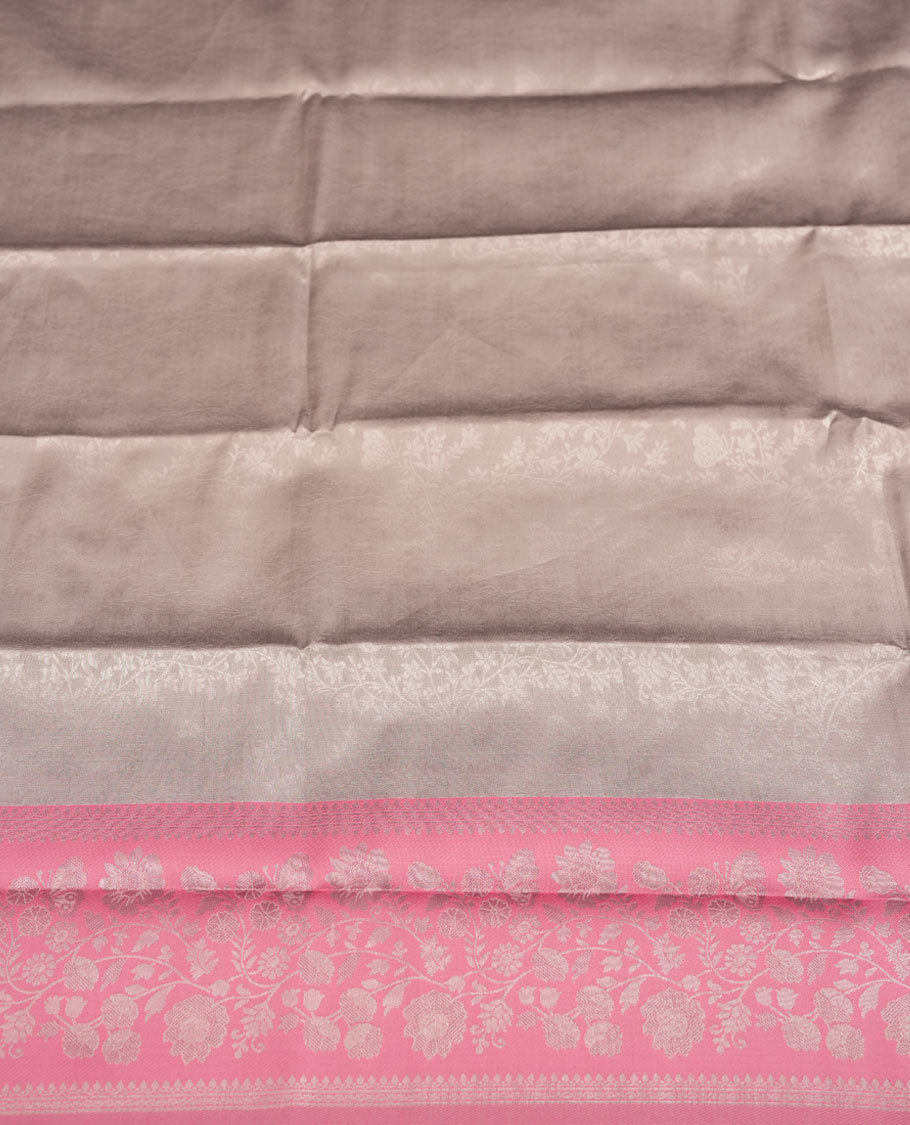 Champagne Beige colour Semi Silk Saree with Allover Subtle Floral Self-Weave on the Body, Contrasting Baby Pink Zari Woven Pallu and Border Featuring Intricate Geometric Motifs and Tassels, Paired with Coordinated Blouse Piece