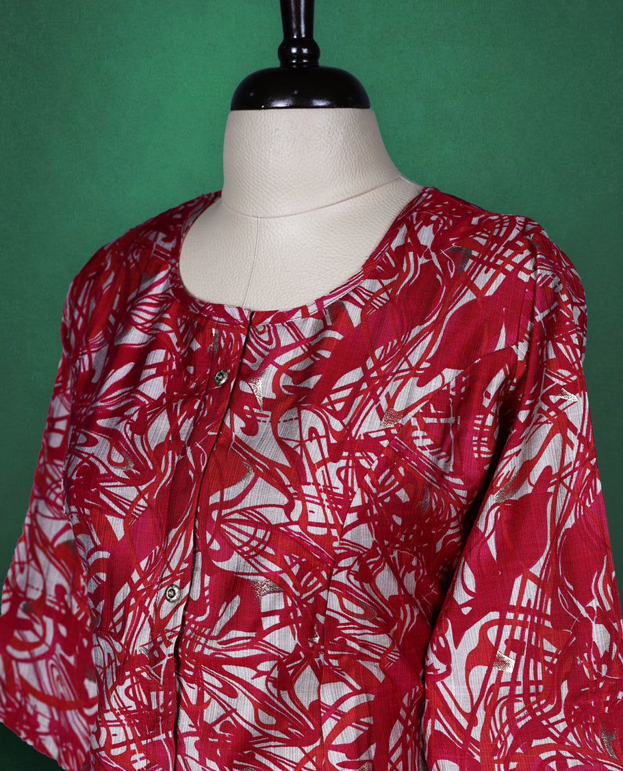 Magenta, red and white printed kurti with all over abstract patterns, featuring a round neckline, front button placket, and elbow length sleeves ideal for a bold and breezy casual look.