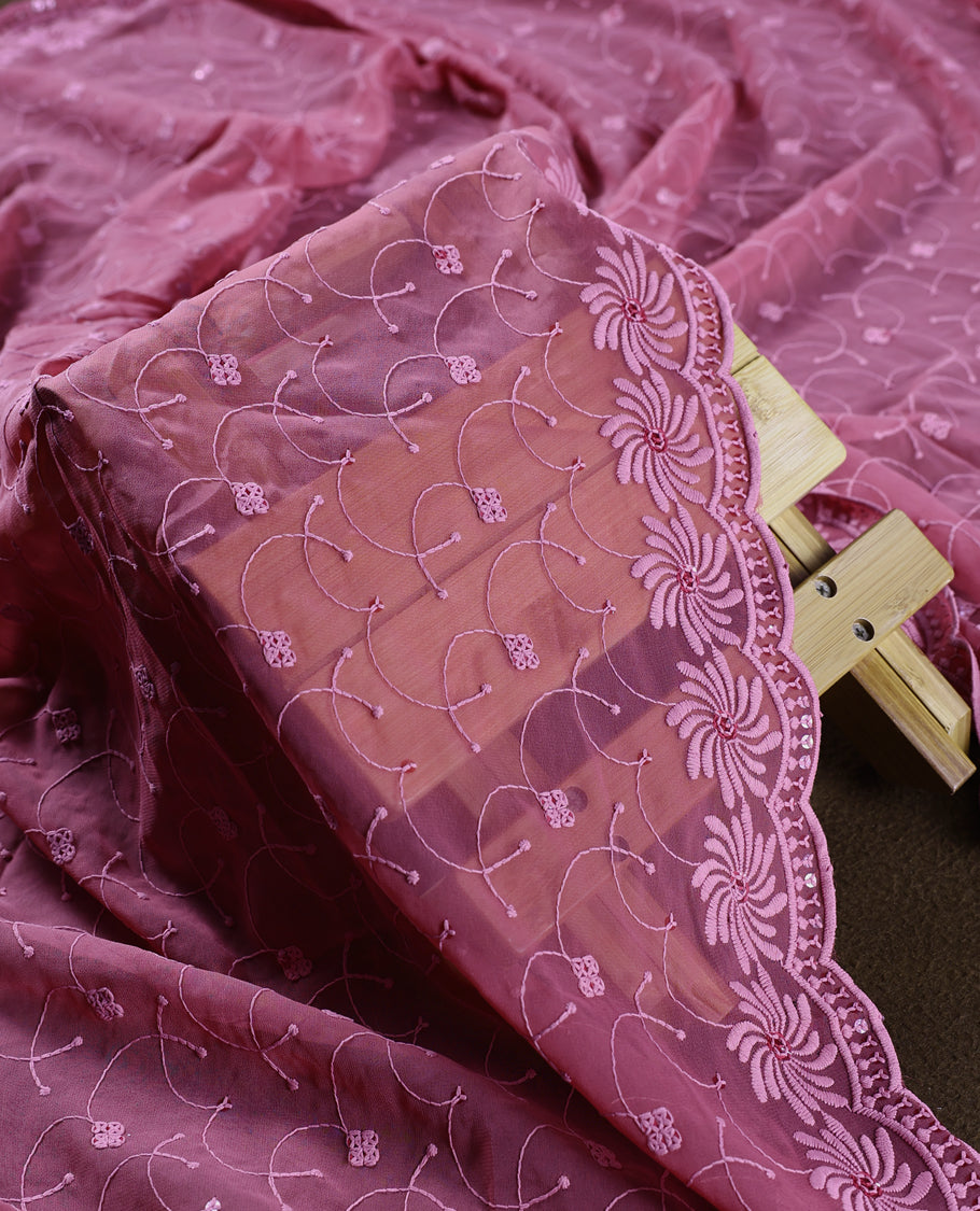 Graceful mauve pink churidhar material featuring rich floral embroidery with sequin accents, paired with a plain matching bottom and intricately embroidered dupatta, making it perfect for festive and elegant occasions.