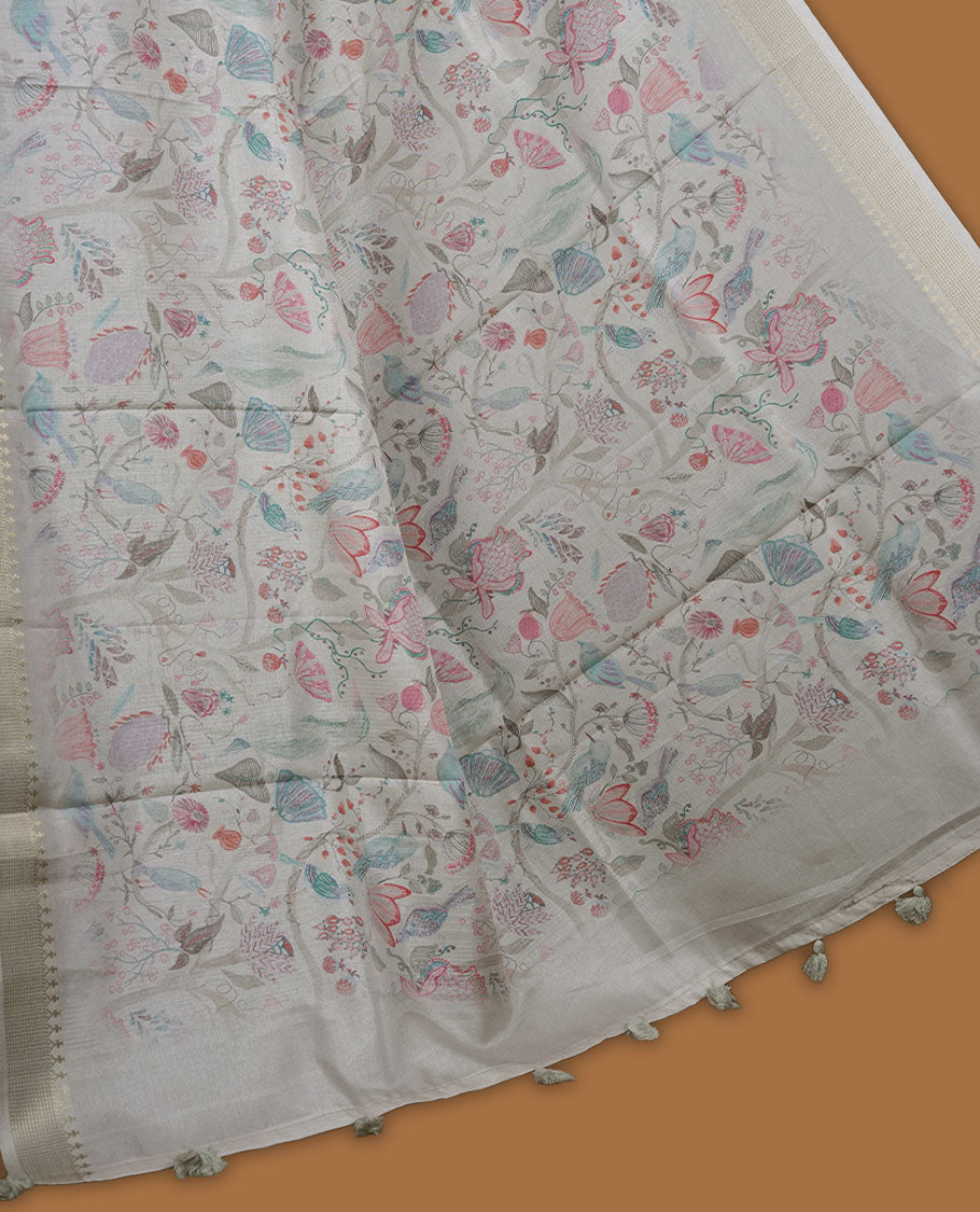 Cream colour semi tussar silk saree featuring all over floral and leaf motifs on the body with a subtle self border and tasselled pallu, paired with a matching blouse.