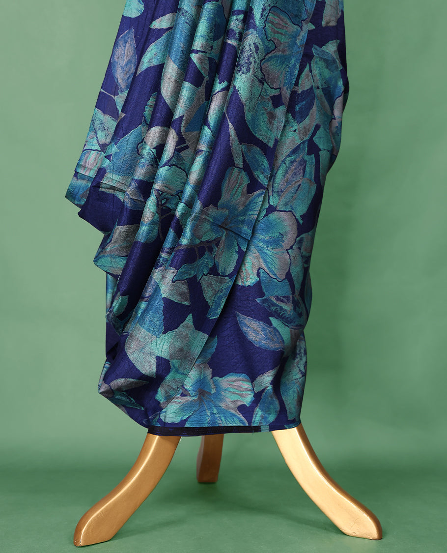 Navy blue colour Manipuri saree adorned with oversized turquoise and teal floral prints, crafted in a smooth finish with a clean, borderless silhouette and a matching blouse.