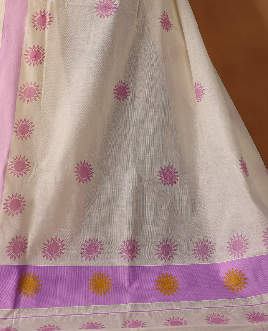 Elegant off white colour cotton Kerala saree featuring Plain body, Lavender colour border with  Flower Block prints, Paired with matching blouse offering a classic and graceful look