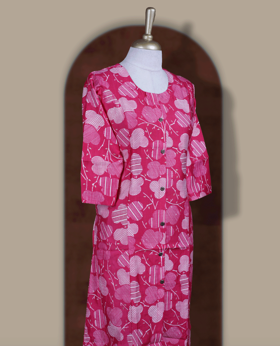 Magenta colour kurthi with off white floral prints, crafted from soft cotton for a breezy and elegant look & Features a round neckline, 3/4th sleeves, and a button down front.