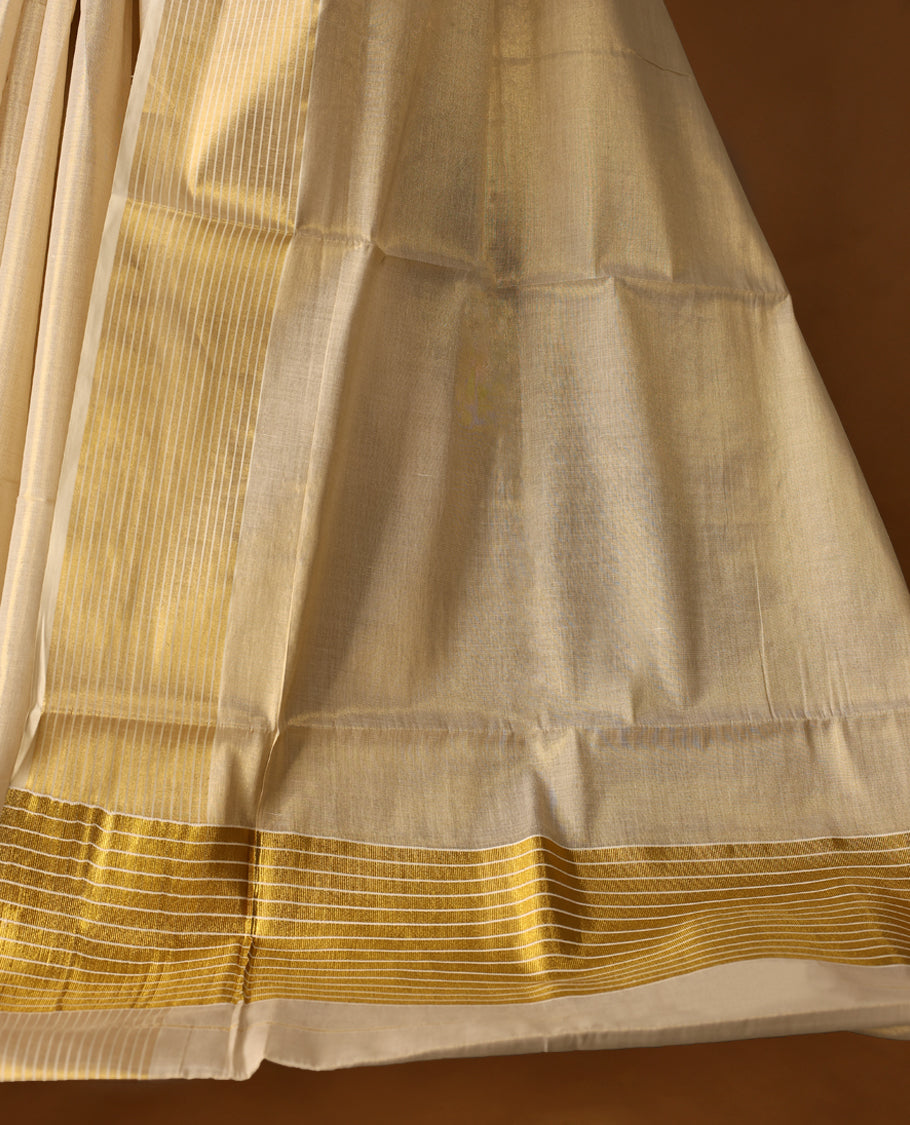 Elegant Light Gold colour Tissue Kerala saree featuring Plain body and traditional golden zari kasavu 5 Inch border  with White stripes offering a classic and graceful look, paired with a matching blouse.