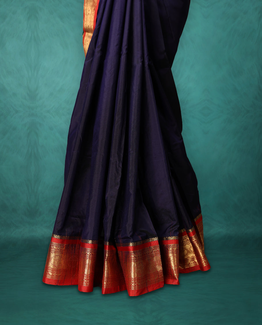 Navy Blue colour Dharmavaram saree with small gold motifs on body, Deep Red traditional border with intricate gold zari weaving, grand zari pallu, perfect for Bharatanatyam, with matching blouse.