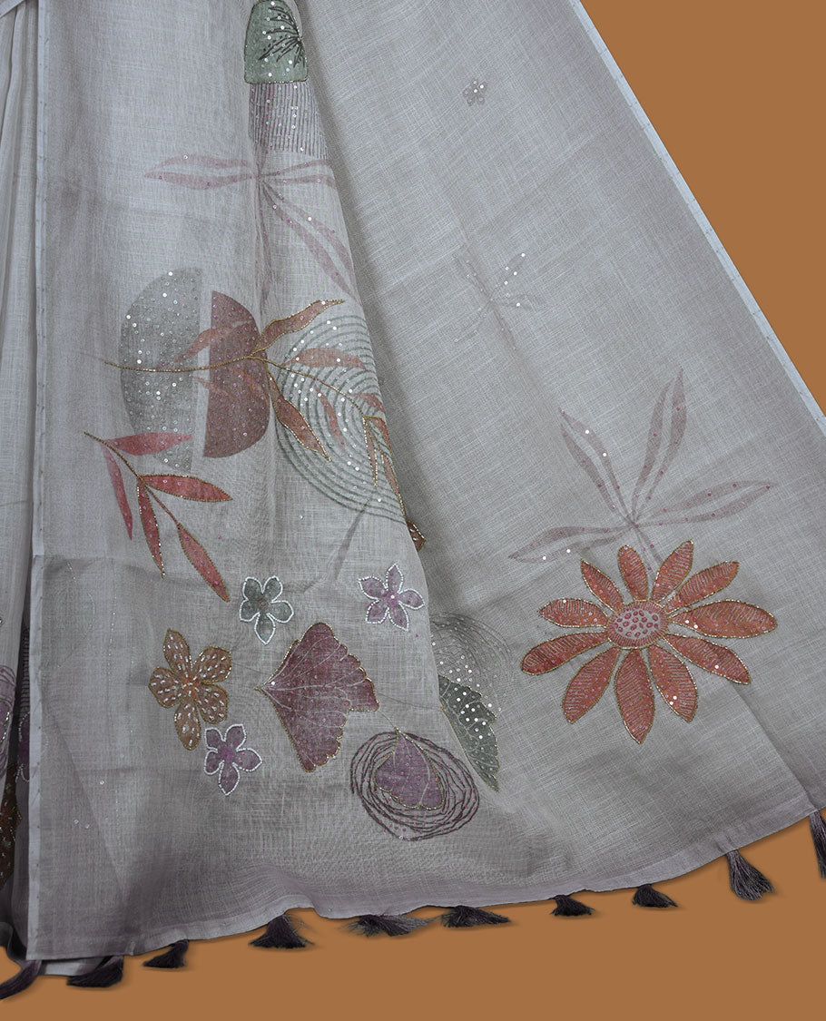 Light Grey colour Linen saree featuring Grey colour fade border with floral beats pattern around floral print across body without border, pallu and matching blouse piece.