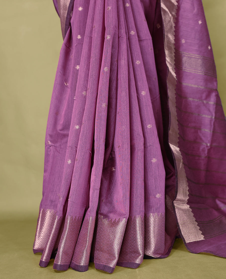 Pastel Purple colour Chanderi cotton saree adorned with delicate Golden Flower motifs on the body, paired with a traditional Mangalagiri style golden zari border with matching blouse.