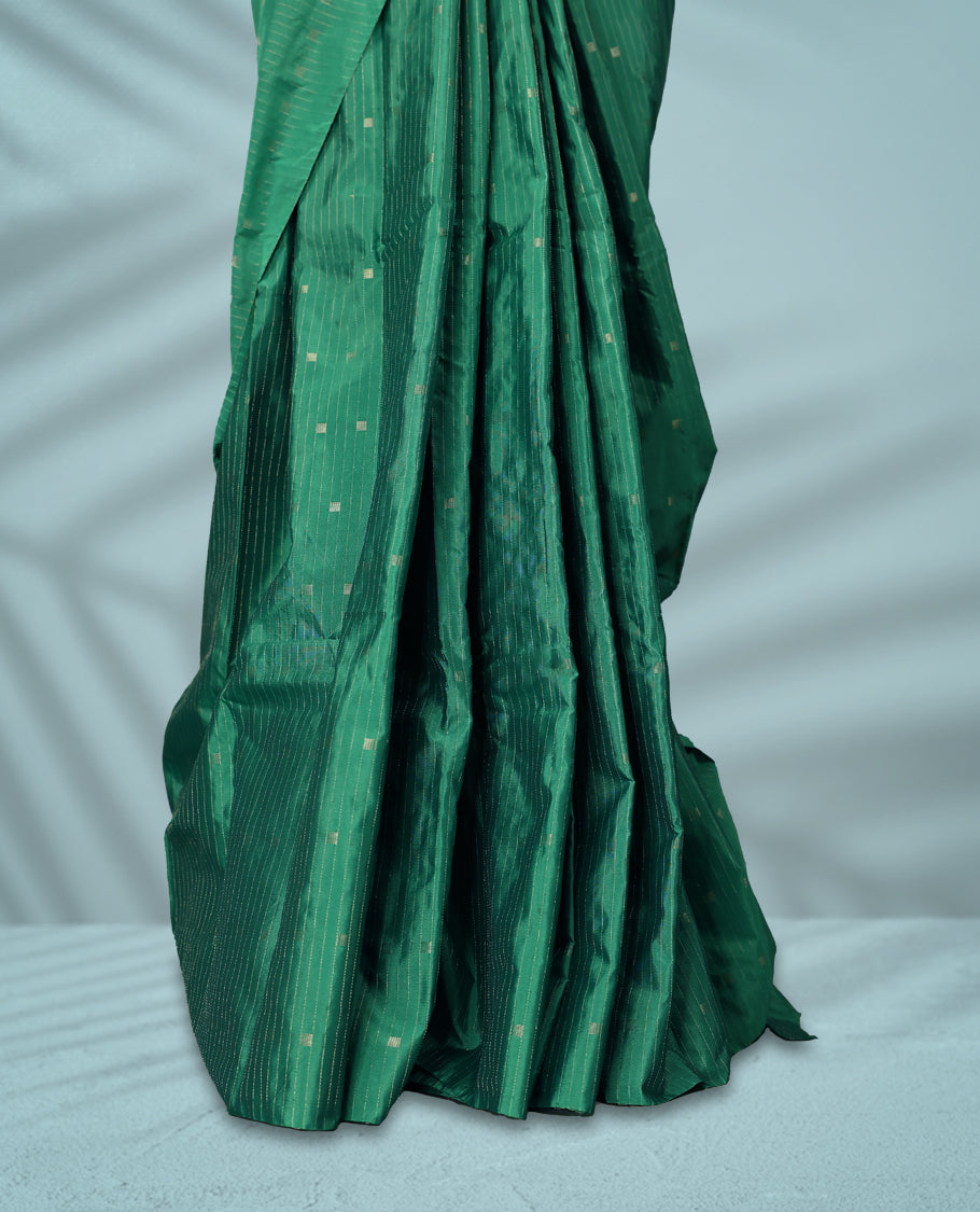 Green Colour semi silk saree showcases delicate square and line motifs all over the body, features a sleek no-border style, and comes with a matching blouse.