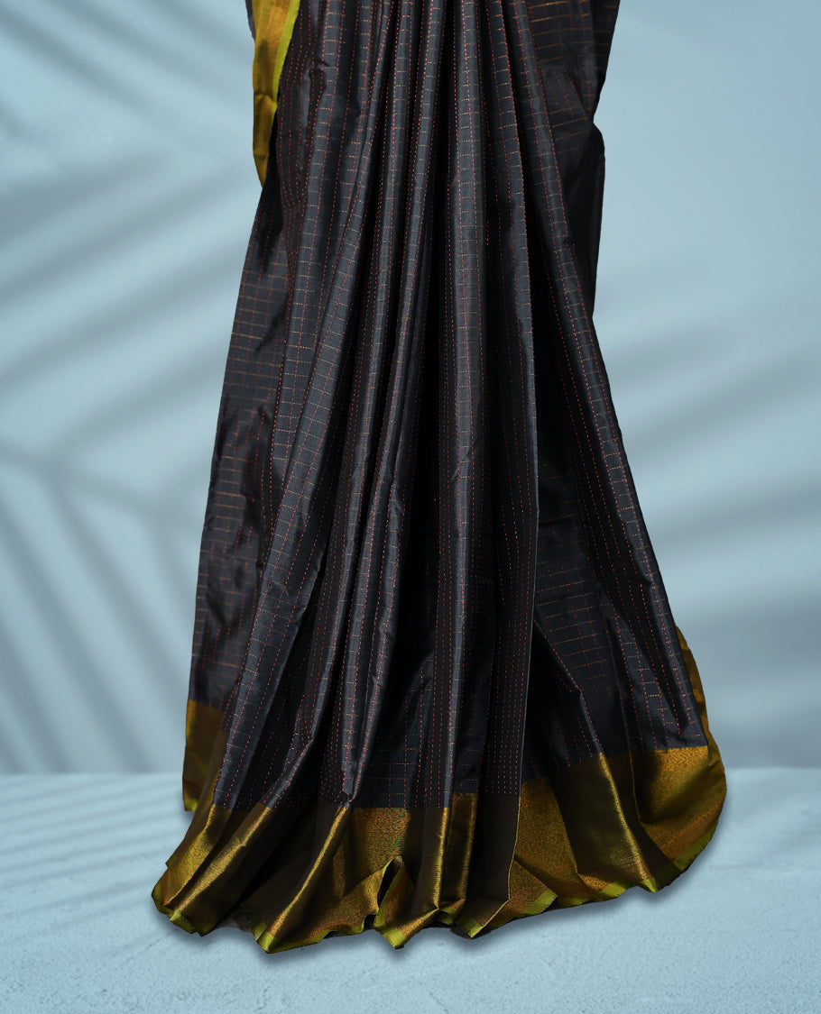 Charcoal grey Colour semi silk saree features a subtle copper zari check pattern, beautifully accented with a copper & olive green border, and comes with a matching blouse