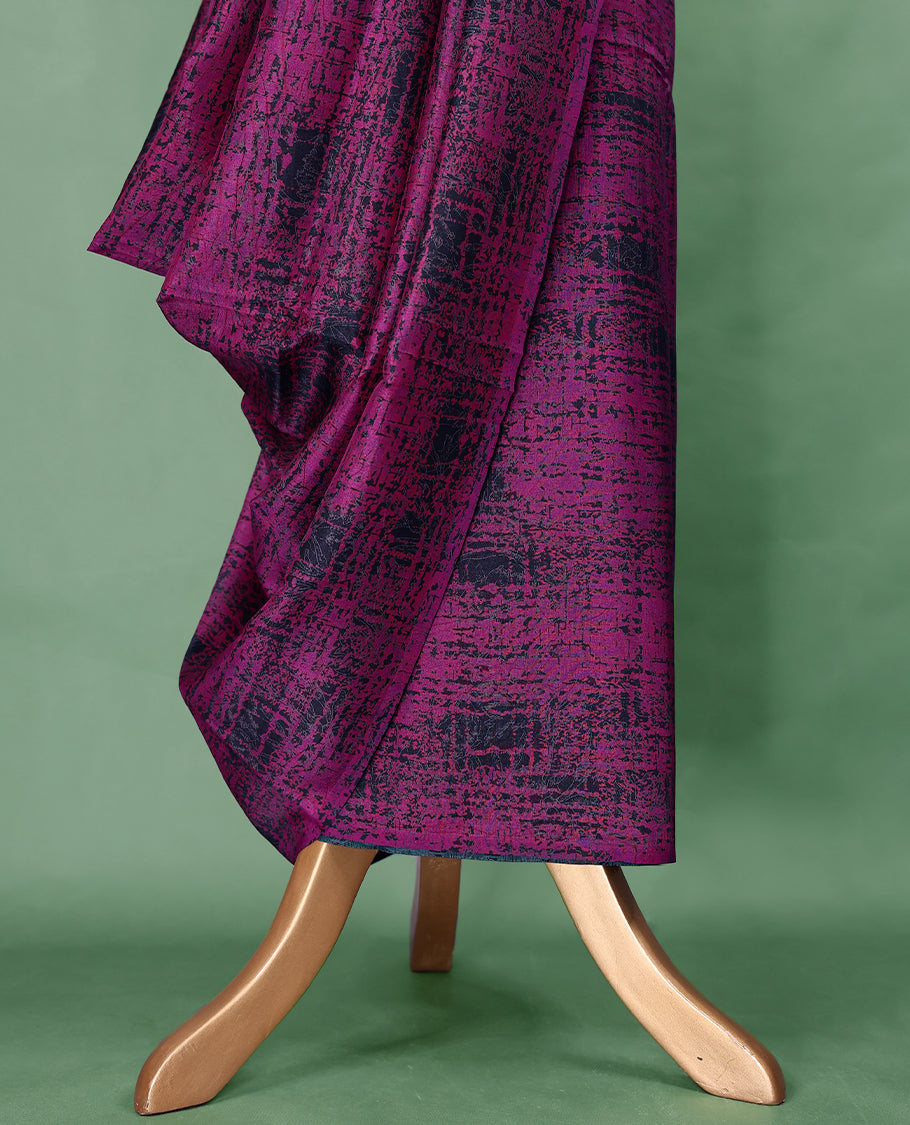 Deep magenta colour Manipuri saree features an abstract black textured pattern throughout the body, creating a bold contemporary statement, without border, and comes with a matching blouse.