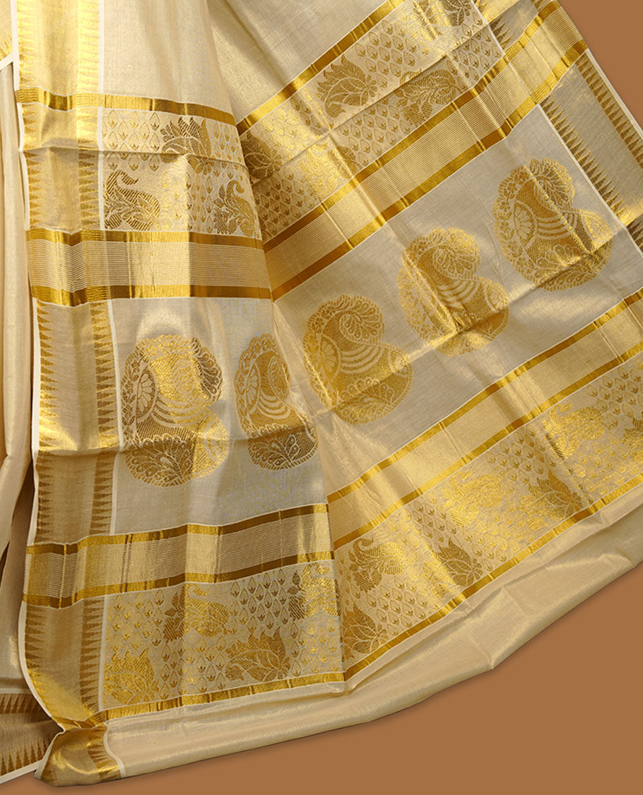 Elegant off-white Kerala saree featuring subtle gold zari buttas across the body, a refined kasavu border with traditional detailing, and a richly woven pallu, paired with a matching blouse