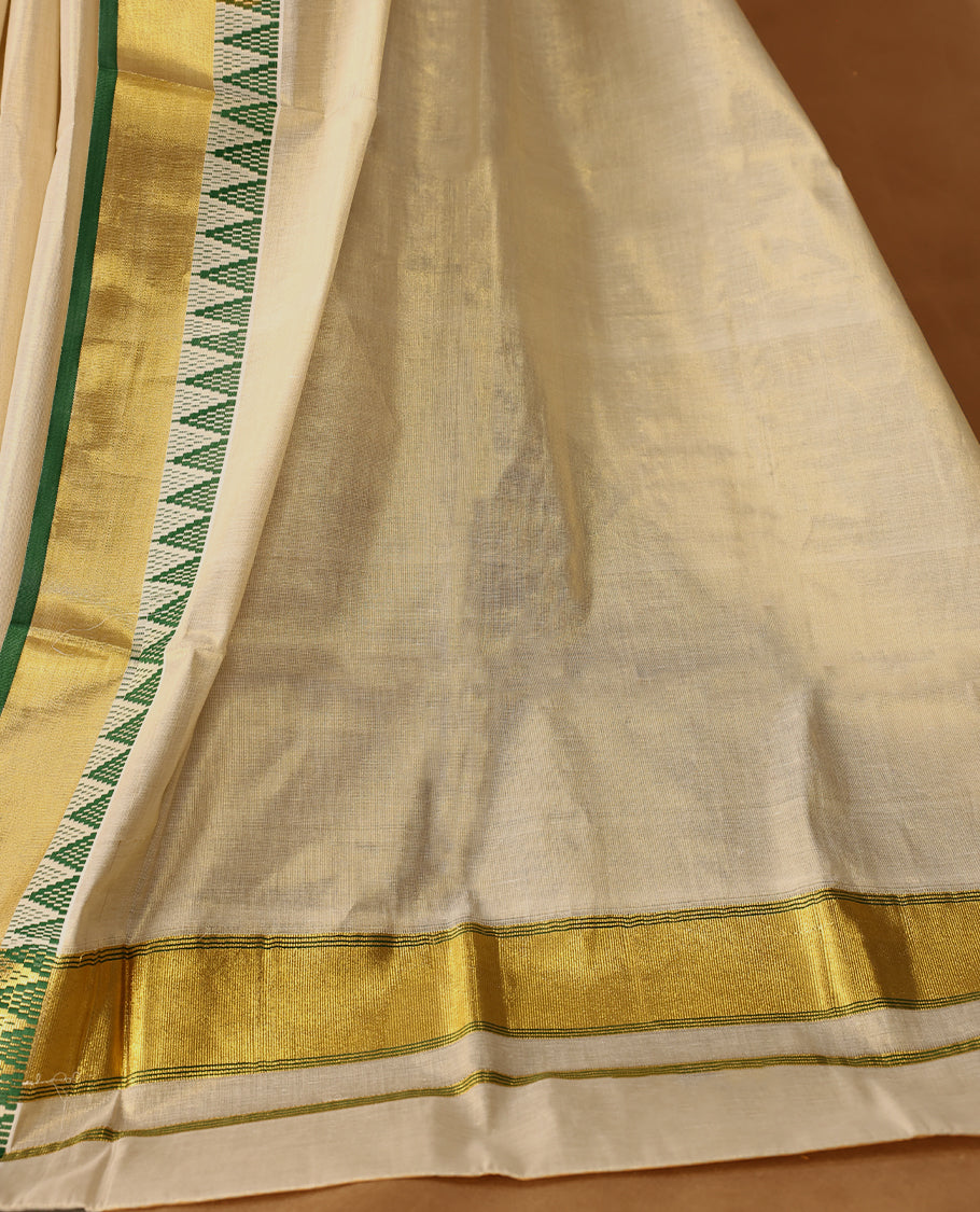 Elegant Light Gold colour Tissue Kerala saree featuring Plain body and traditional golden zari kasavu border with Green colour temple work offering a classic and graceful look, paired with a matching blouse.