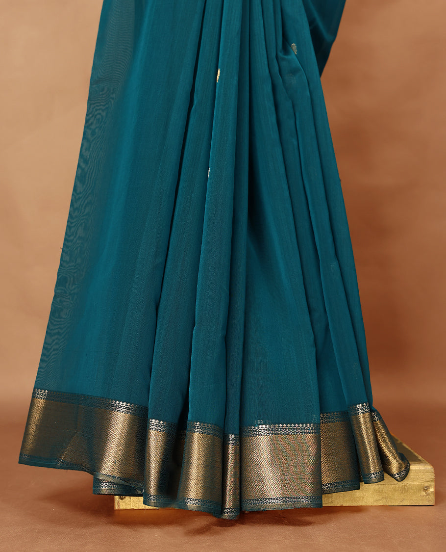 Peacock Blue colour Maheshwari Cotton saree featuring Antique Zari bindi Patterns across the entire body, complemented by a traditional Gold Zari border & Pallu, with a matching blouse.
