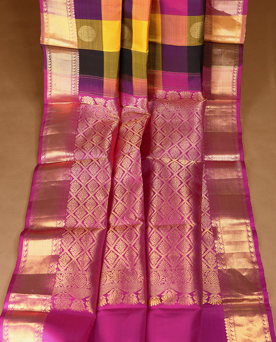 Pink, yellow, and black Checked pure traditional Kancheepuram silk saree adorned with antique zari Chakkram motifs on the body, elegantly complemented by a traditional mango design border, and paired with a matching blouse.