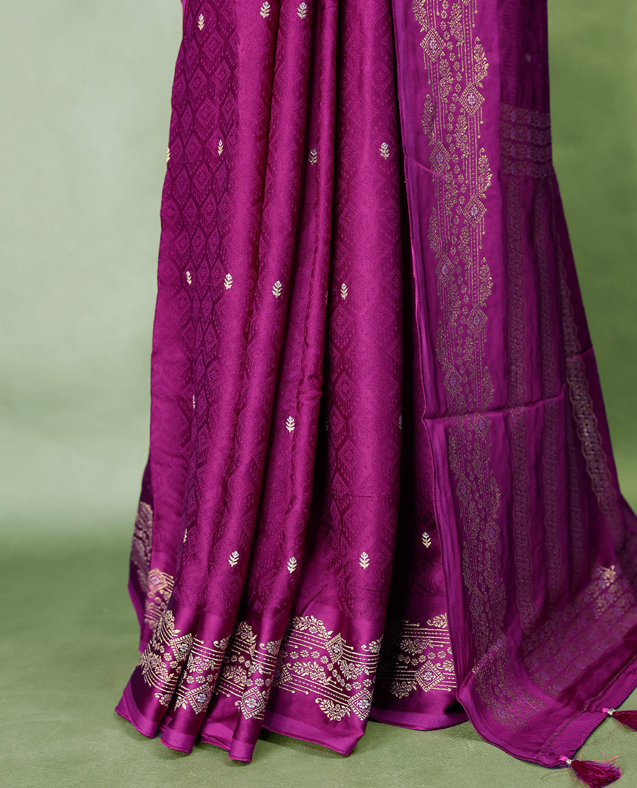 Grape colour pure Banaras crepe saree showcases elegant Gold & Silver zari Motifs all over the body, a traditional gold & Silver zari border, a rich intricately woven pallu, and comes with a matching blouse.