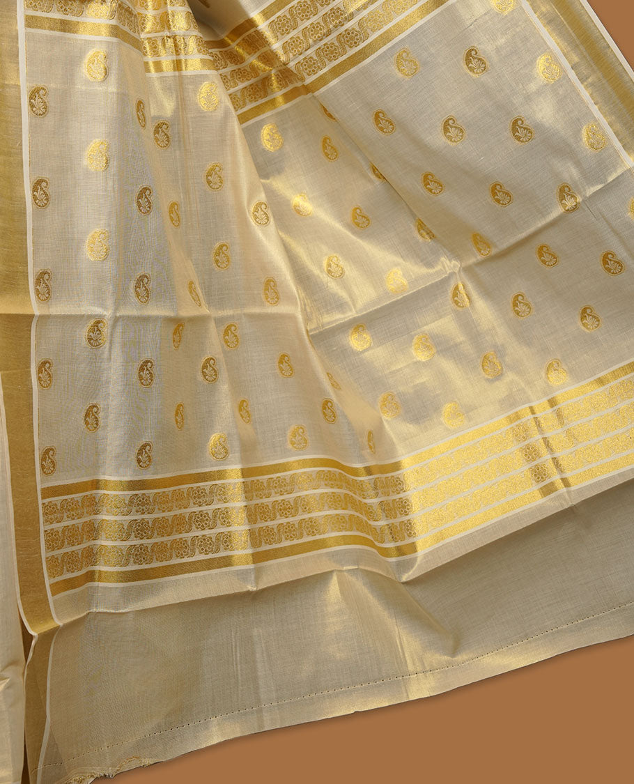 light gold tissue Kerala saree featuring delicate gold zari buttas across the body, a subtle kasavu border, and a finely woven traditional pallu, paired with a matching blouse