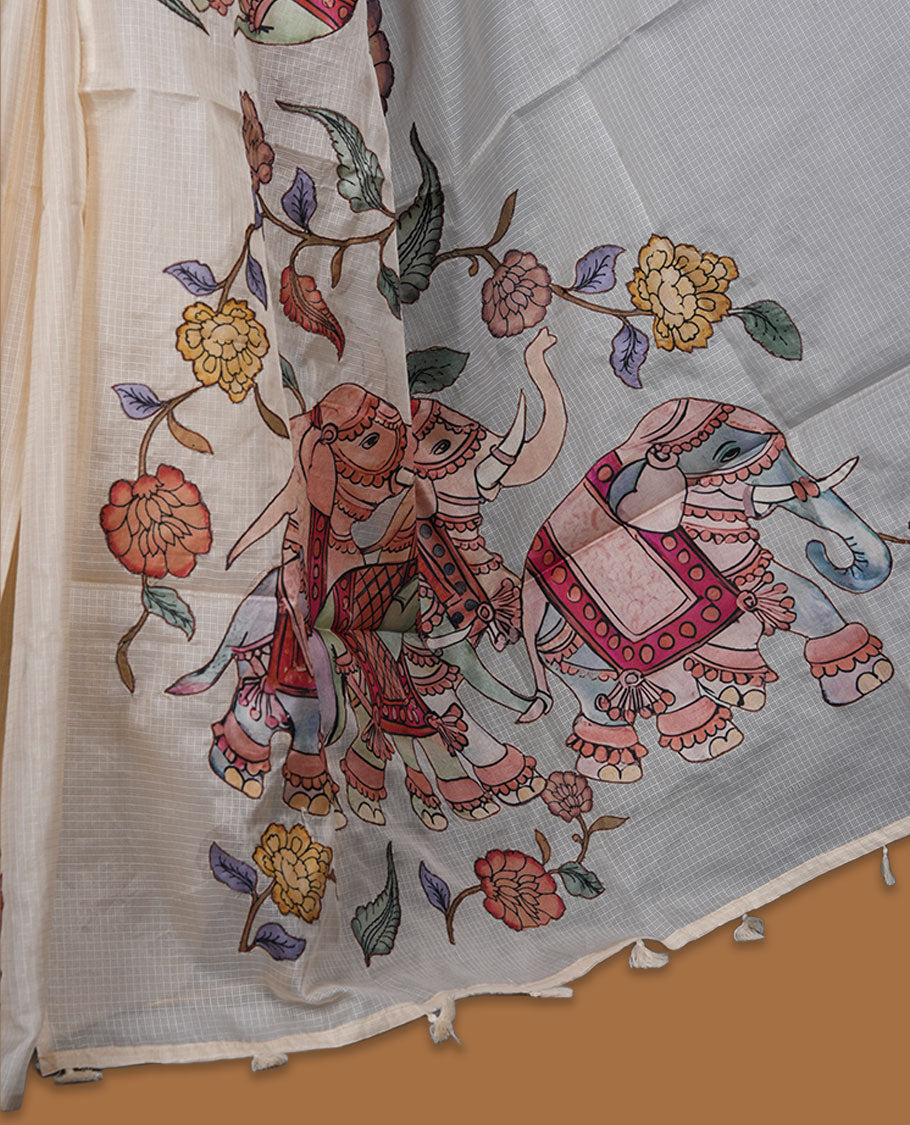 Cream off-white semi tusser silk saree featuring artistic floral and elephant motifs on the pallu with subtle contrast detailing along the border, paired with a matching printed blouse.