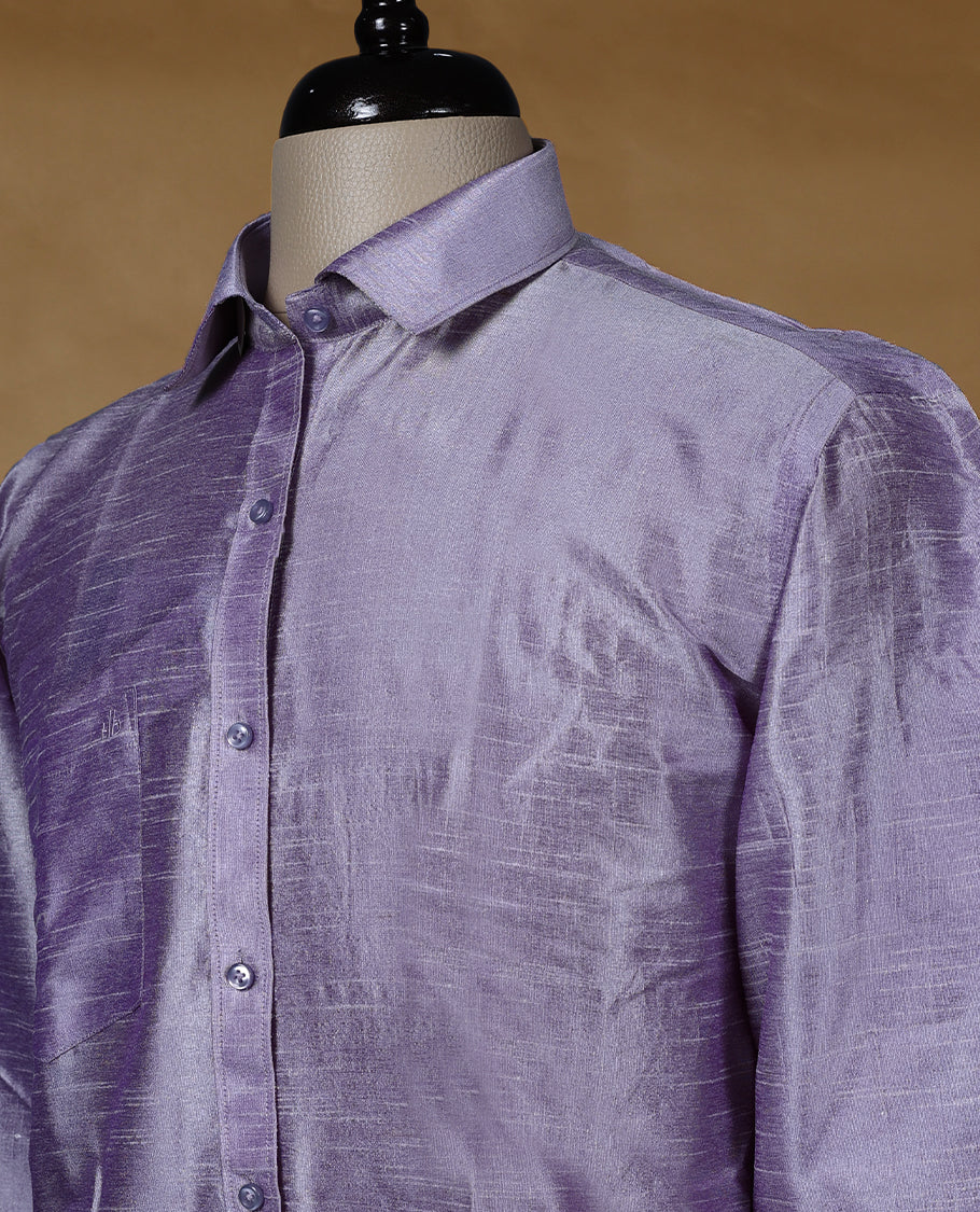 Lavender lilac colour DH men’s shirt in a relaxed formal fit featuring a lustrous semi silk finish, full sleeves, classic collar, and chest pocket ideal for festive and traditional occasions.