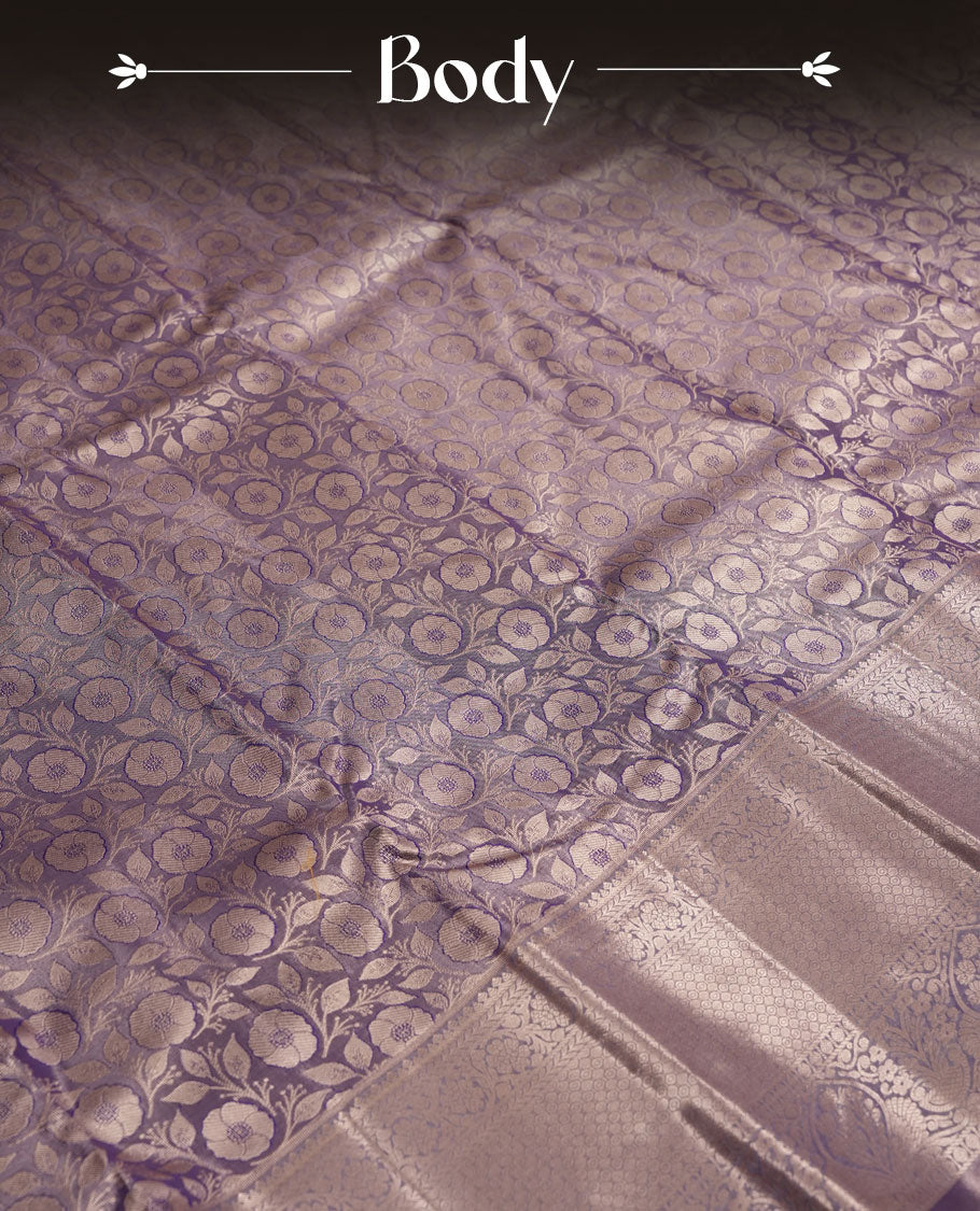 Purple colour and Antique silver Zari Tissue Brocade Saree features intricate Motifs on body and traditional border & pallu with floral patterns, paired with matching blouse