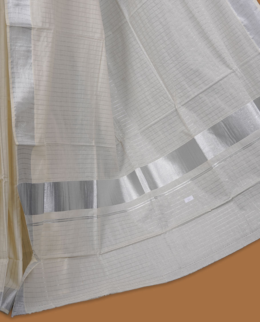 Off-white colour cotton Kerala saree featuring a silver line pattern, finished with an elegant silver kasavu border along the edges and pallu, and paired with a matching blouse.