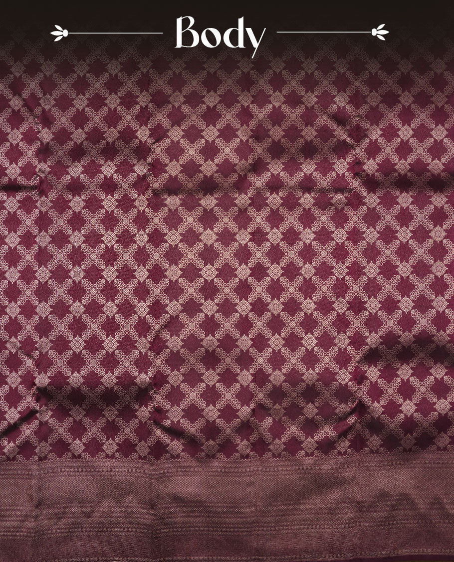 Dark wine colour Kanchipuram pattern Manthrakodi saree adorned with diamond antique gold zari jacquard on the body, highlighted by a rich geometrical pattern border and complemented with a self jacquard blouse piece.