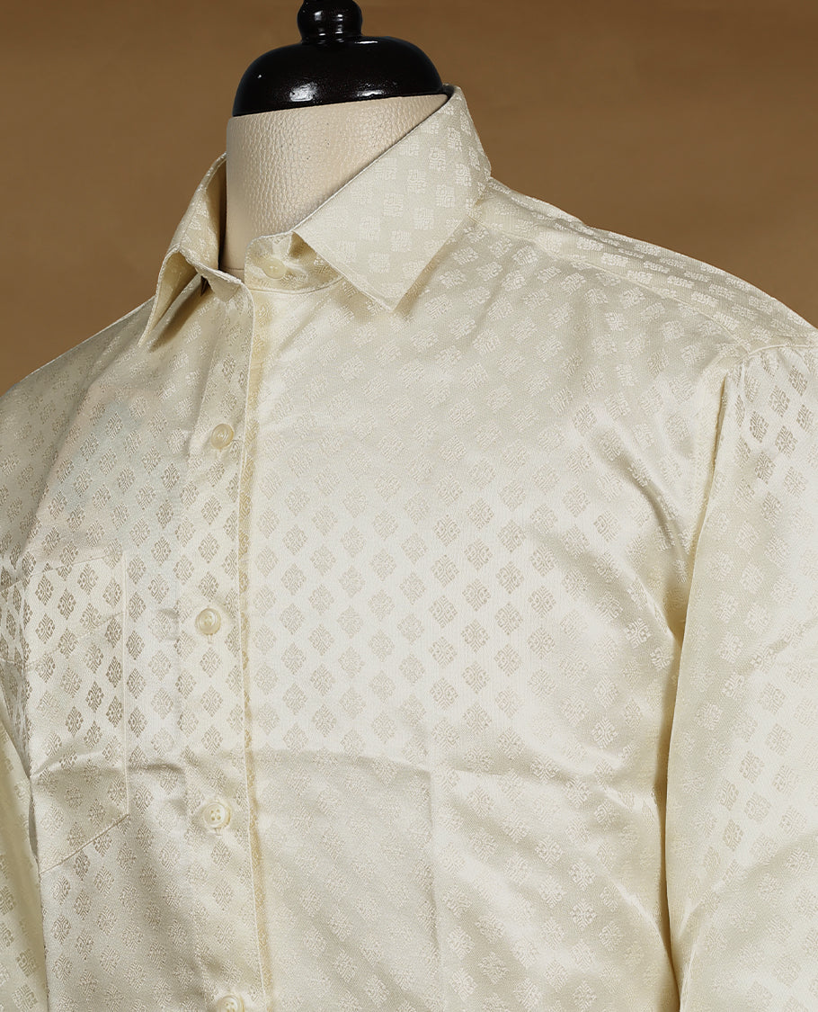 Cream ivory Denim Marton men's wedding shirt with a glossy finish, featuring diamond jacquard self-design, full sleeves, classic collar, and a chest pocket.