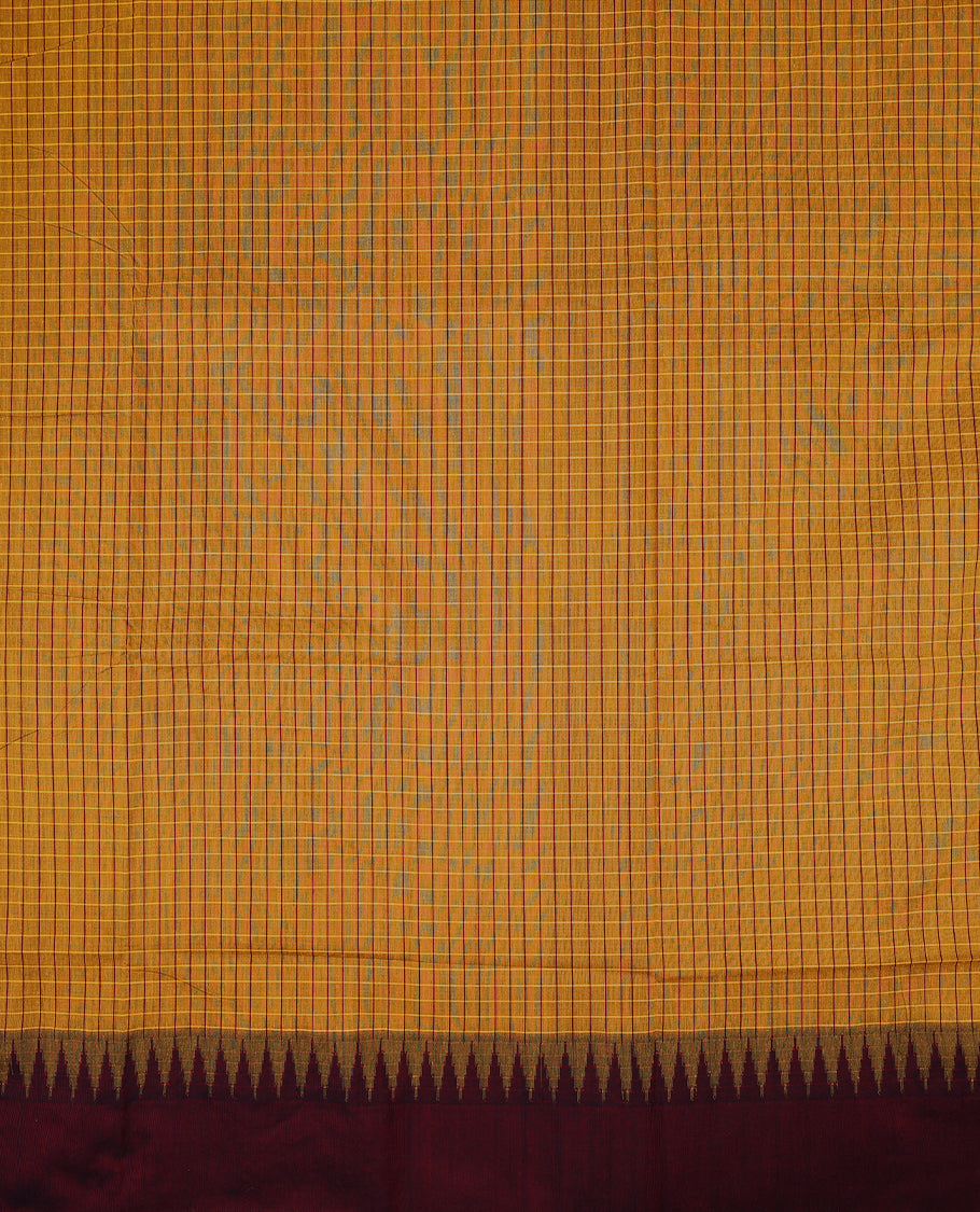 Brighr Mustard colour mixed Kalyani cotton saree featuring Maroon Checks throughout the body, paired with a Maroon colour traditional border and pallu, with matching blouse