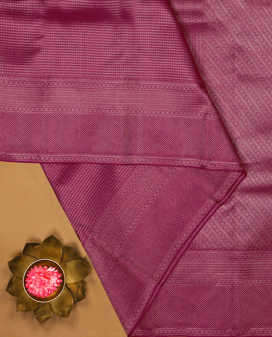 Dark pink Colour Manthrakodi saree featuring an antique zari brocade pattern on the body, complemented by a traditional Laddu Kamalam brocade border and a matching brocade blouse.