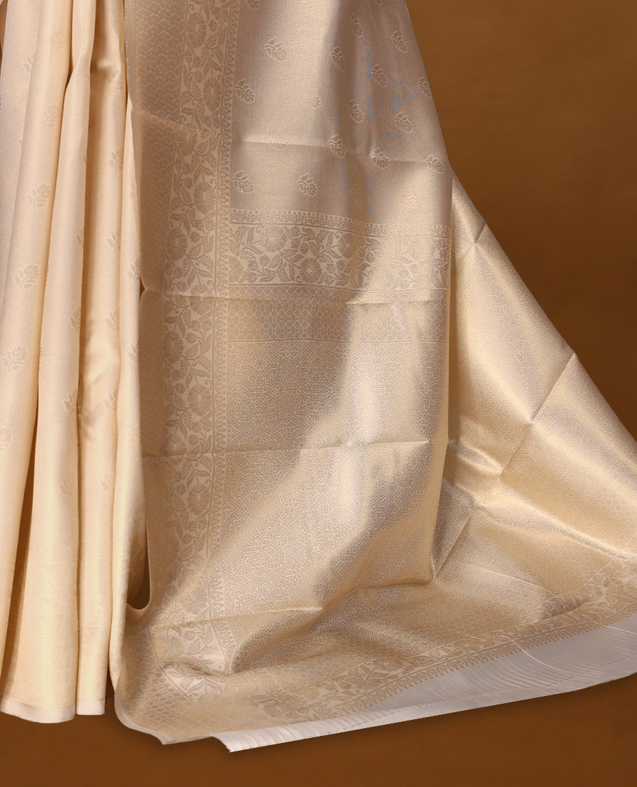 Muted gold Colour soft tissue Kerala saree featuring selfcolour flower motifs on body, Floral kodi designed border, paired with a matching blouse.