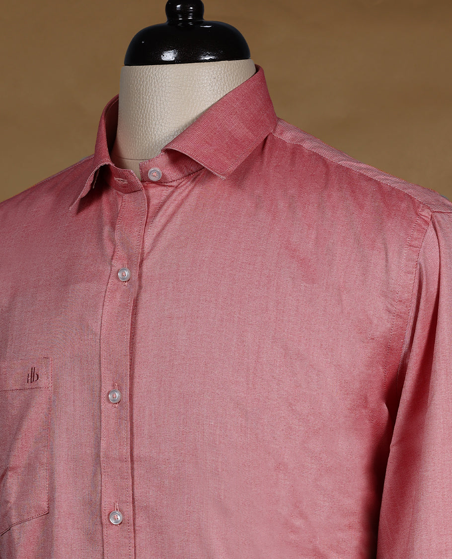 Dusty rose DH men’s shirt crafted in a glossy soft textured fabric featuring a rich sheen, classic collar, full sleeves, and chest pocket perfect for festive and elegant occasions