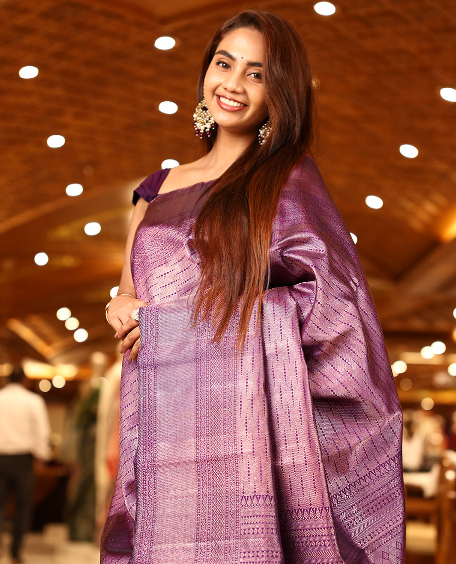 Grape colour pure Kancheepuram brocade silk saree featuring a micro dot brocade body, chattari brocade border, pallu woven with Vangi star design, paired with a matching brocade blouse