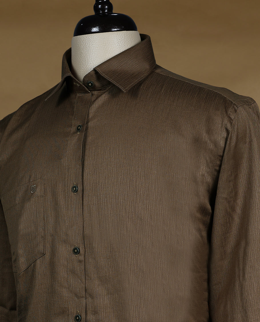 Dark brown colour OTTO men’s shirt in a relaxed formal fit featuring a subtle glossy texture with full sleeves, classic collar, and chest pocket perfect for elegant occasions