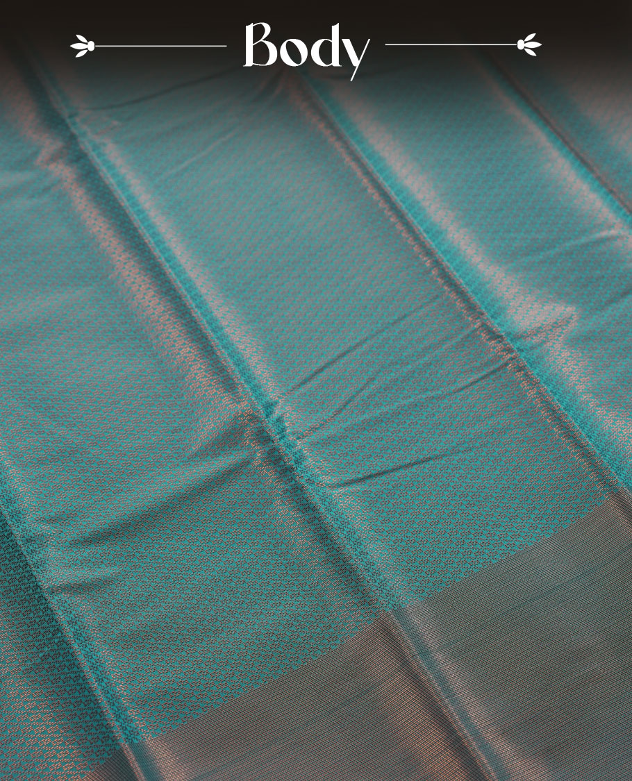 Deep aqua blue colour semi silk saree featuring neem zari Brocade Pattern all over the body, complemented by a Self Colour woven border with detailing with contrast Maroon Colour Pallu & blouse.