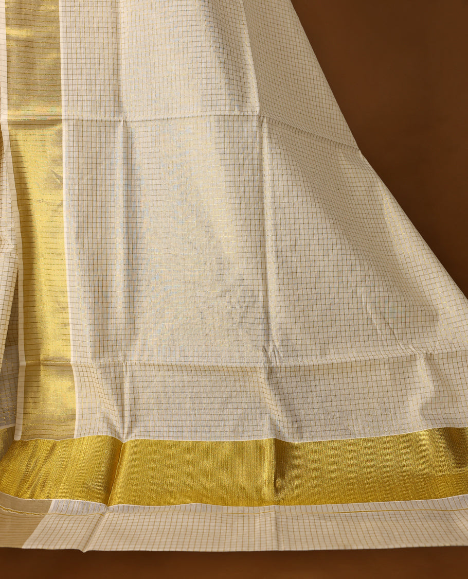 Elegant off white colour cotton Kerala saree featuring gold Zari Striped body, gold zari traditional kasavu border offering a classic and graceful look, paired with a matching blouse.