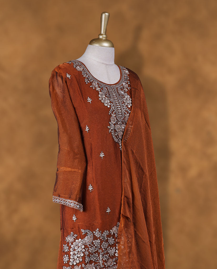 Brown colour sharara set adorned with intricate silver embroidery and sequins work & The fitted embellished top pairs beautifully with the flared bottoms and matching dupatta.