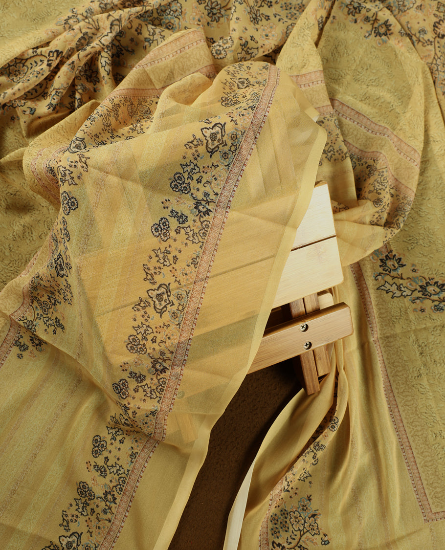 Pastel yellow colour churidhar material with intricate floral prints, sequin embroidery on the top, plain matching bottom, and a coordinated dupatta.