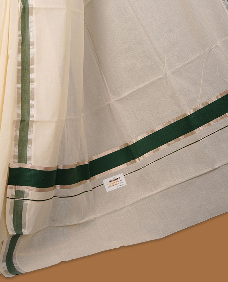 Off-white colour cotton Kerala saree featuring a subtle green border with silver zari accents, a clean plain body and pallu, and paired with a matching blouse.