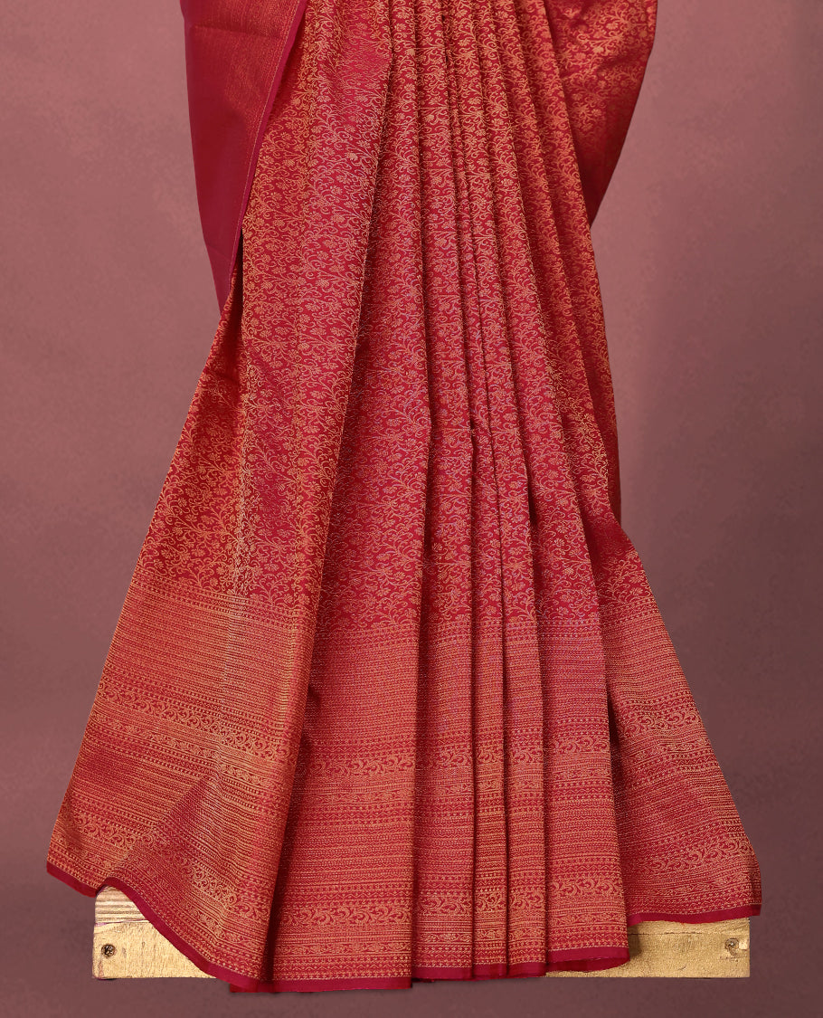 Rani Pink colour Kancheepuram saree featuring an antique zari brocade body, complemented by a traditional border and a matching blouse.