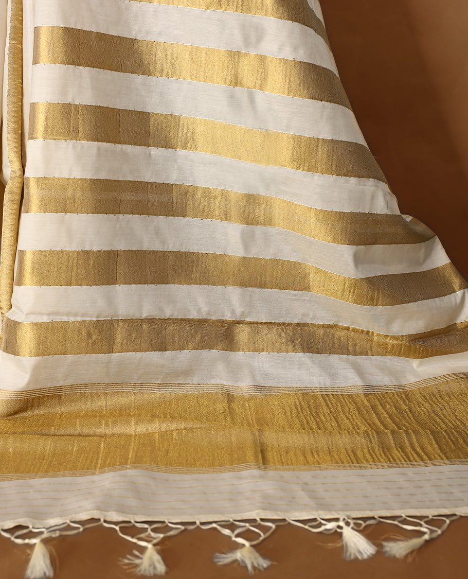 Elegant white colour sotf  Tussar Kerala saree featuring Gold Zari Bold stripes on body, Rich Pallu, Paired with matching blouse offering a classic and graceful look
