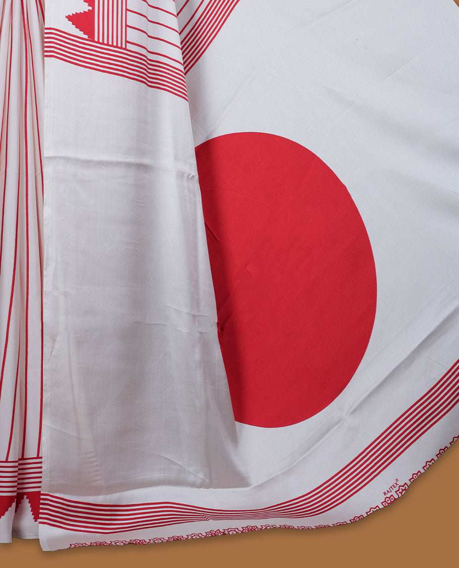 White colour semi modal saree highlighted with bold red triangle borders and fine striped detailing across the drape, featuring a striking oversized red circular motif on the pallu, paired with an all-over printed matching blouse.