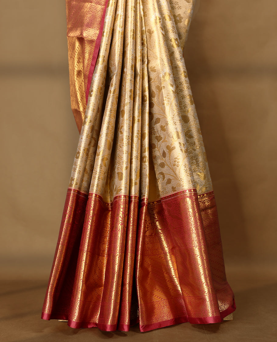 Gold colour tissue brocade saree with gold and silver zari floral kodi design on body, gold zari traditional floral and peacock work Maroon border, rich matching pallu with Antique zari motifs, paired with matching blouse.