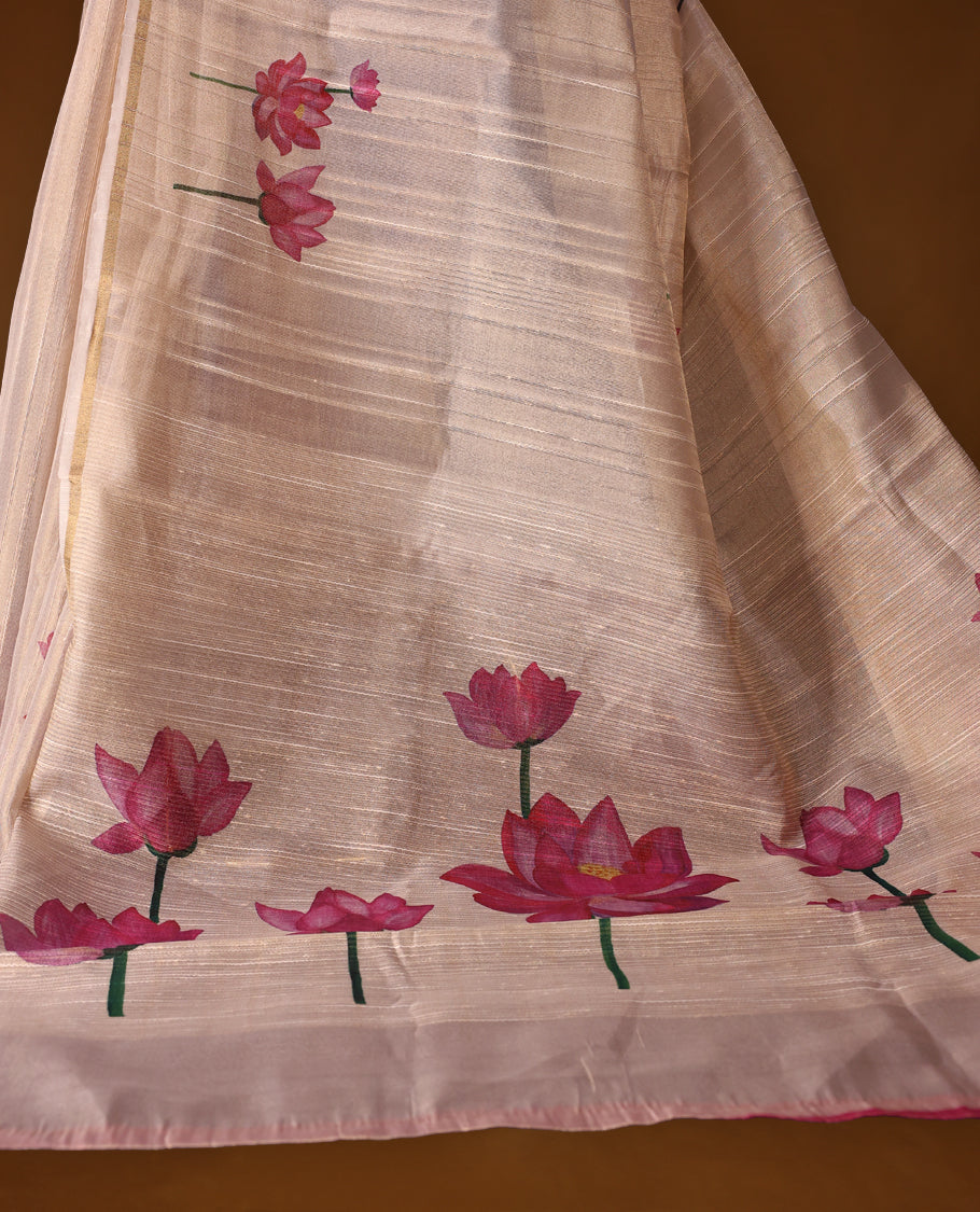 Ethereal off white colour organza Kerala saree adorned with hand painted pink lotus motifs and a subtle zari style border, Lightweight and graceful, paired with a matching blouse & perfect for festive celebrations and elegant gatherings.
