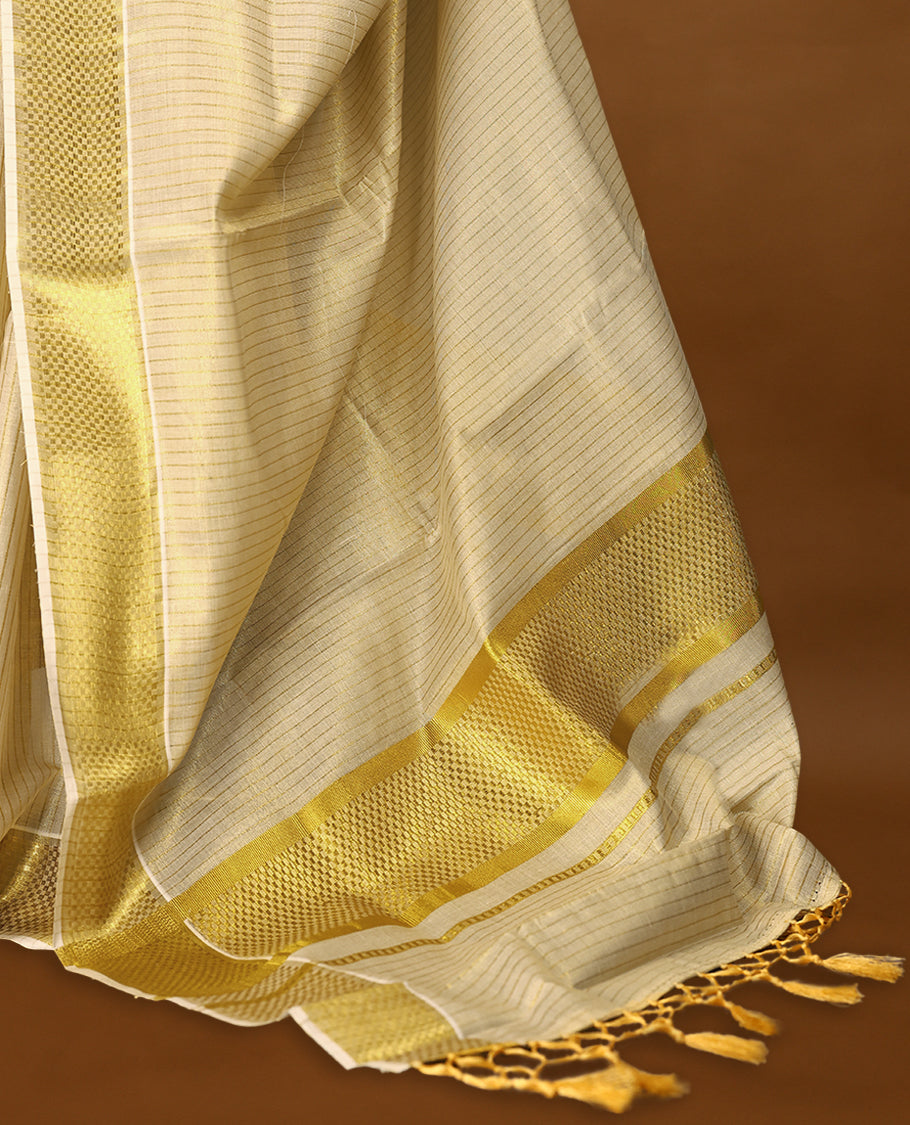 Kerala tissue saree features intricate golden zari work woven into delicate stripes and bold borders with Matching Blouse