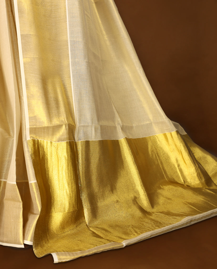Light Gold colour Tissue Kerala saree featuring Plain body and a beautifully woven muted Gold Kasavu border, Grand Pallu paired with a matching blouse perfect for festive occasions.