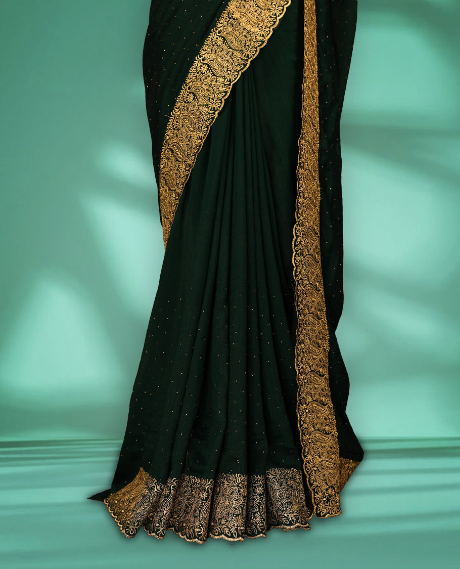 Bottle Green colour Vichitra silk fancy saree featuring tiny stone embellishments across the body, accentuated with a heavy floral embroidery border in gold thread, with matching blouse