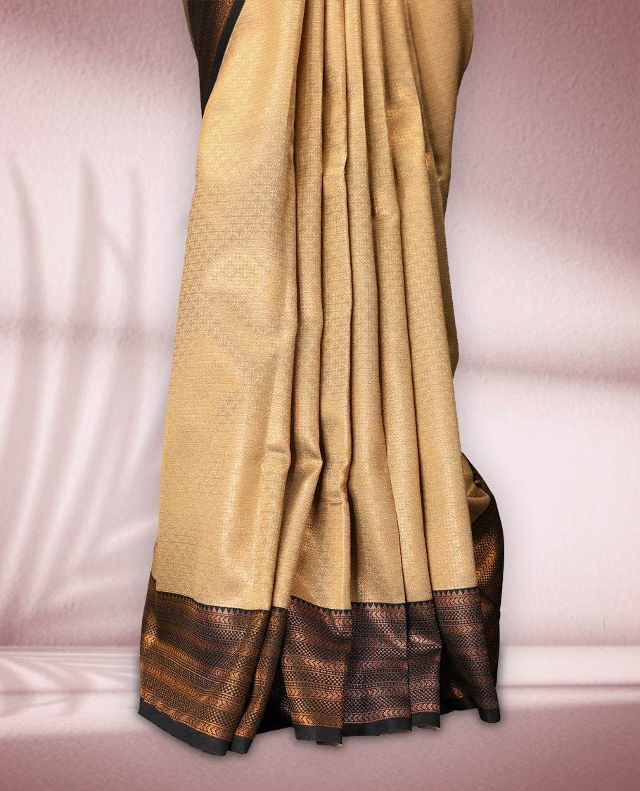 Beige colour semi silk brocade saree featuring intricate gold zari woven patterns across the body, paired with a rich Black and gold zari woven border in traditional motifs, with matching blouse