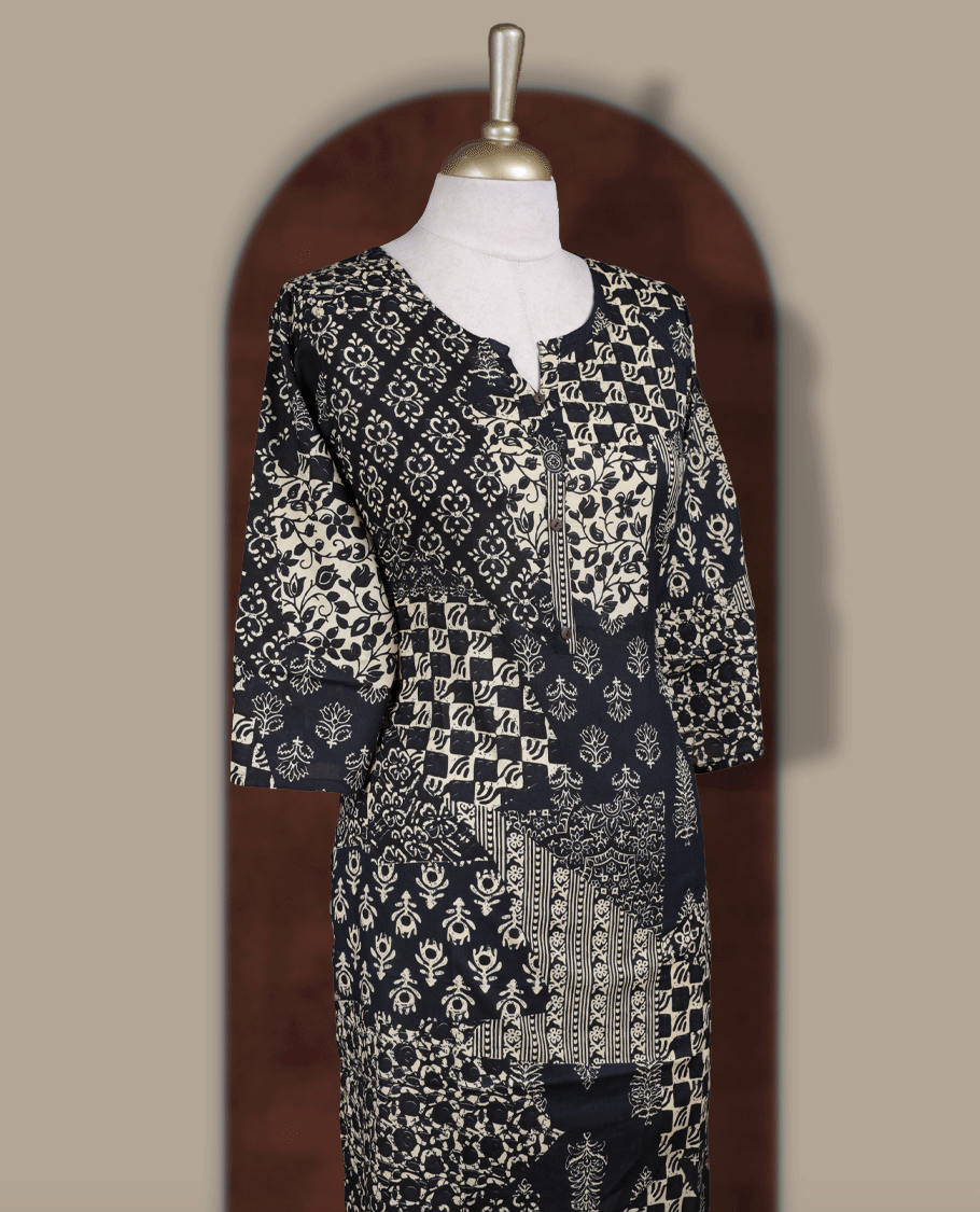 Black colour kurthi featuring elegant beige block prints in a mix of traditional patterns & Designed with a round neckline, button placket, and 3/4 sleeves.