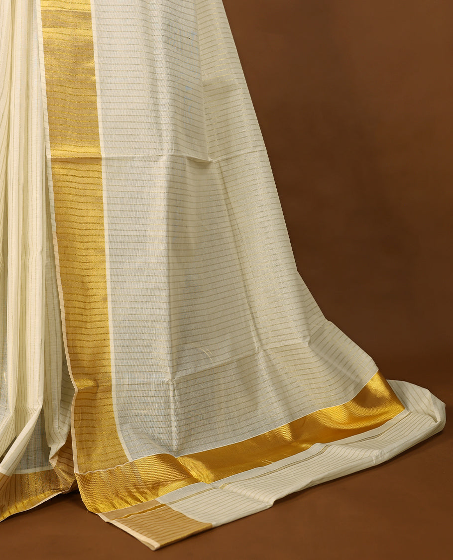 Off White Kerala Kasavu saree featuring a broad golden zari border with subtle striped detailing, paired with a matching blouse