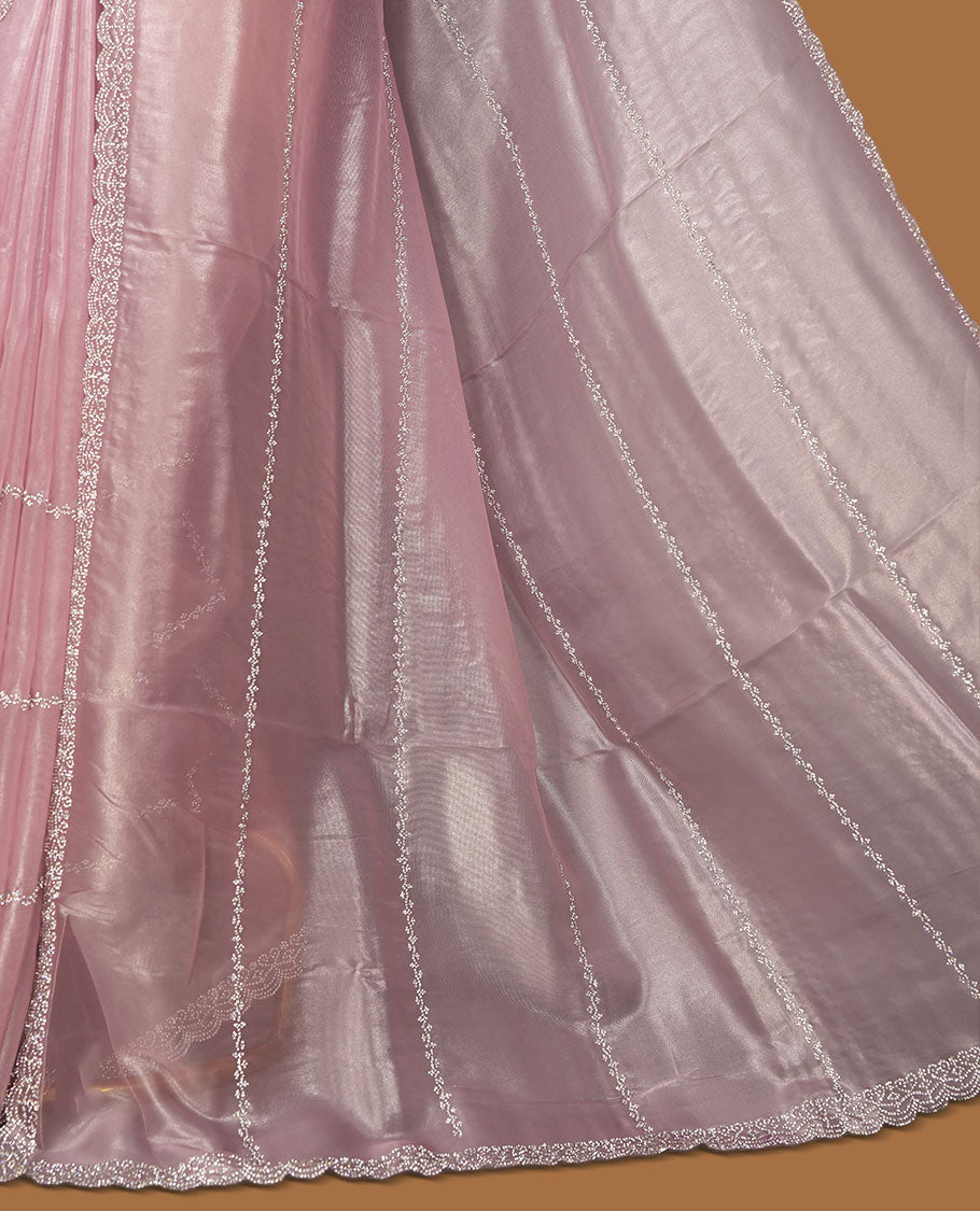 Pastel pink Colour net shimmer fancy saree adorned with white stone buttas with design over the body, paired with a delicate stone worked border and matching blouse