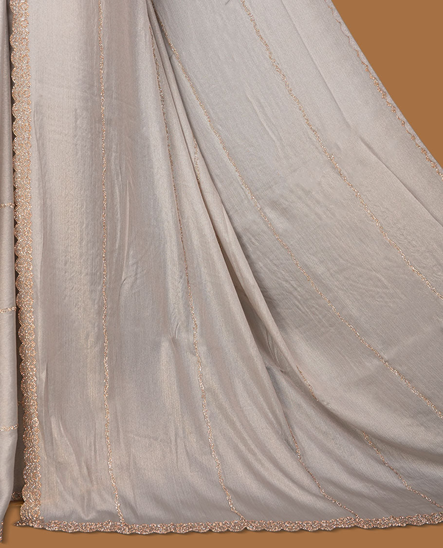 Silver Pink colour net shimmer fancy saree adorned with scattered white stone buttas, paired with a delicate stone worked border and matching blouse.